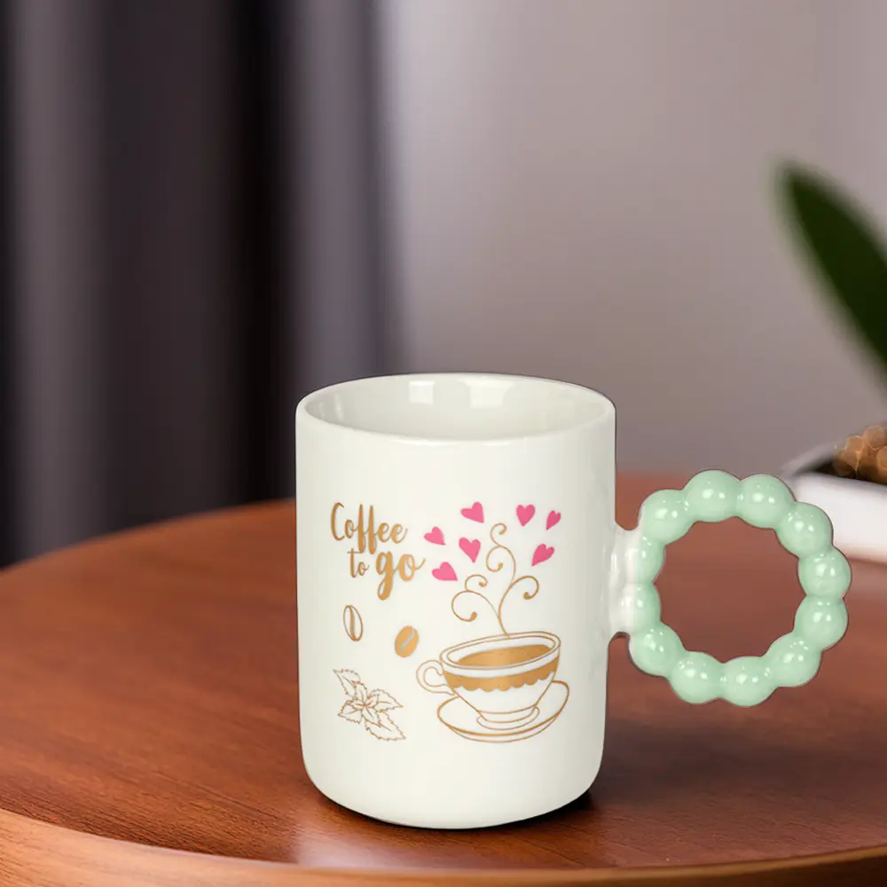 Ceramic white mug with aqua bubble design handle1