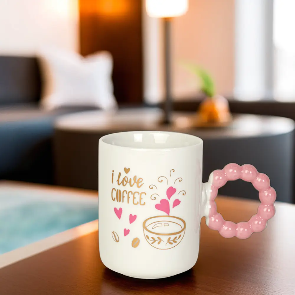 Ceramic white mug with pink bubble design handle1