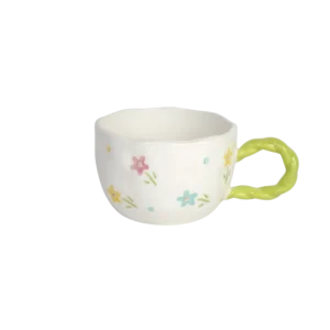 Ceramic floral design mug with light green handle