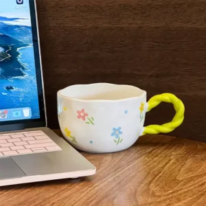 Ceramic floral design mug with light green handle1