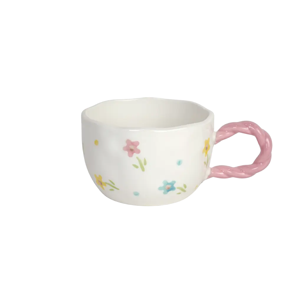 Ceramic floral design mug with pink handle
