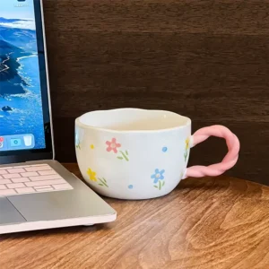Ceramic floral design mug with pink handle1