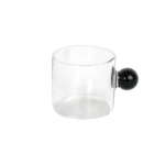 Small glass transparent coffee cup with black ball handle