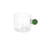 Small glass transparent coffee cup with green ball handle