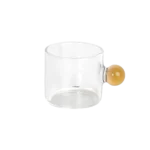 Small glass transparent coffee cup with yellow ball handle